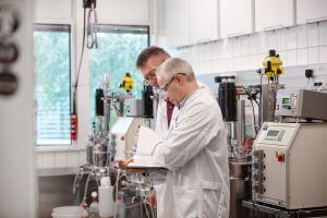 Two IFF experts busy working in an IFF laboratory, creating better dairy flavors through bioscience