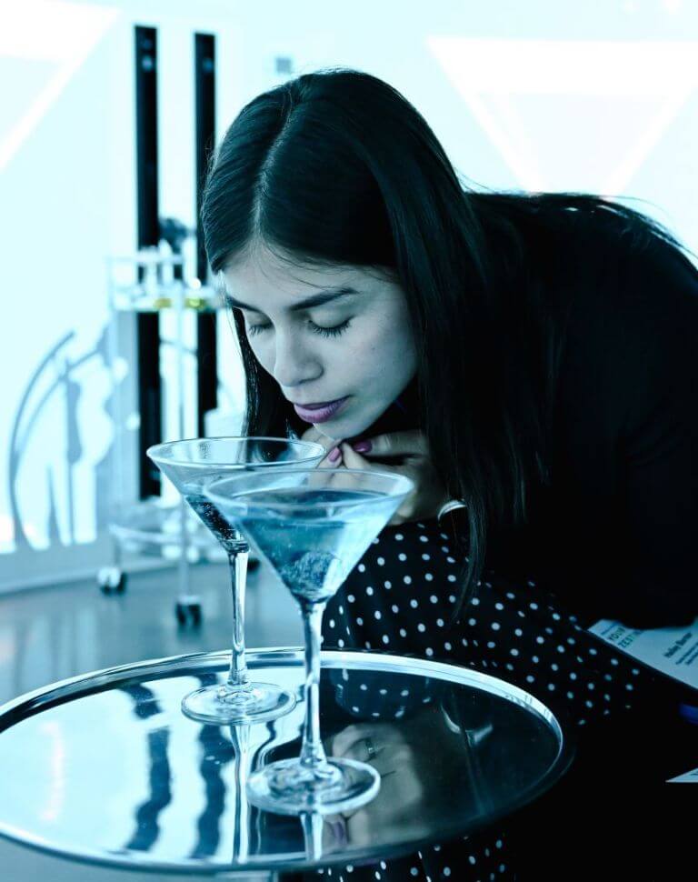 A woman having an immersive experience at an IFF Kaleido grand opening event in Florida