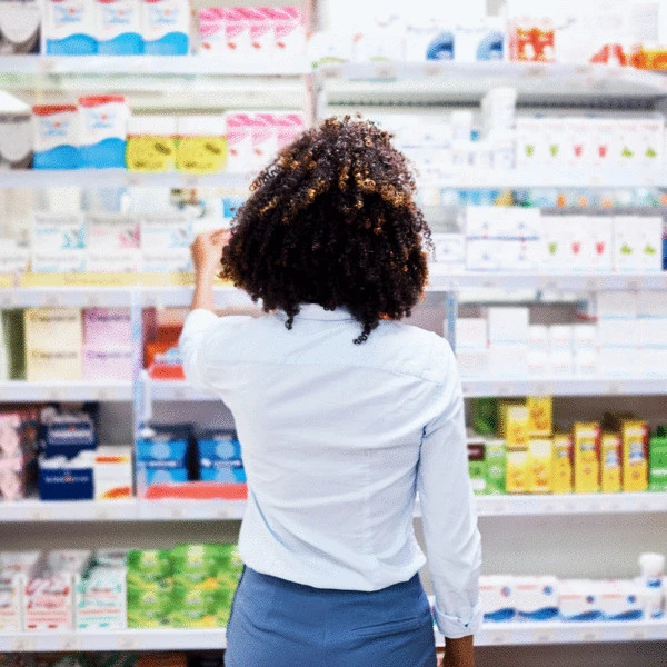 Consumer browsing health and wellness products, reflecting microbiome‑focused probiotic formulation, enzymes, and metabolic health solutions from a probiotic manufacturer